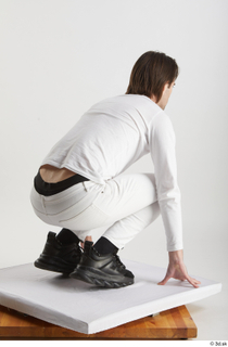 Chadwick  1 black sneakers dressed kneeling white jeans white…